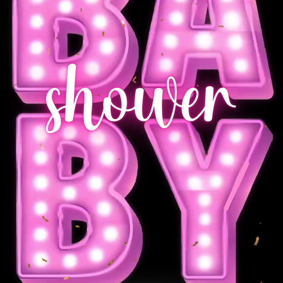 Editable pink neon baby shower baby shower video invitation displayed on a mobile phone, featuring an animated vertical digital invite with music, created in Canva. This premium video invitation template is designed for sharing by text, email, and social media and works with an interactive RSVP website for easy guest response tracking.
