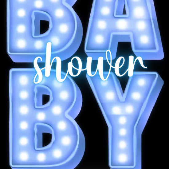 Editable blue marquee boy baby shower baby shower video invitation displayed on a mobile phone, featuring an animated vertical digital invite with music, created in Canva. This premium video invitation template is designed for sharing by text, email, and social media and works with an interactive RSVP website for easy guest response tracking.